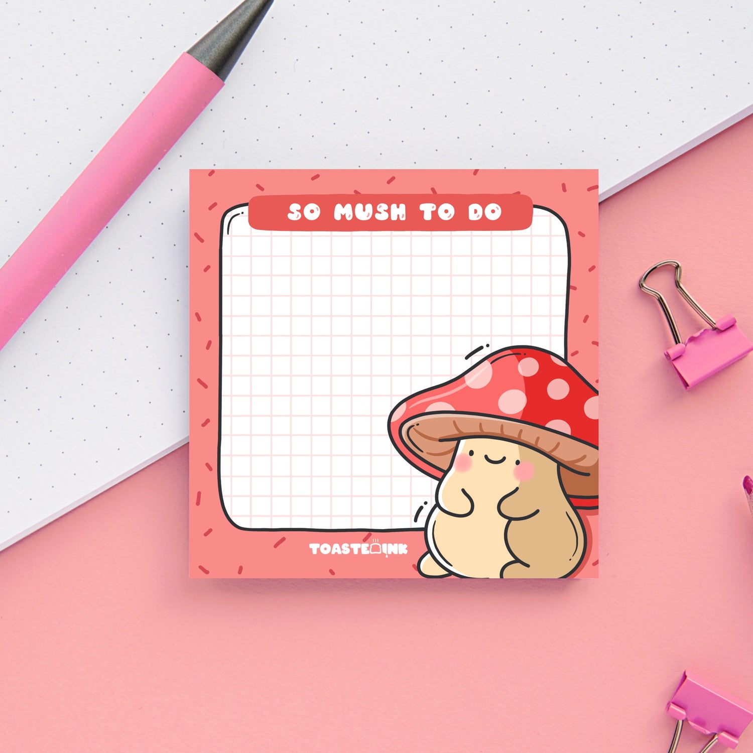 Mushroom sticky notes on pink and white table