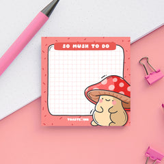 Mushroom sticky notes on pink and white table