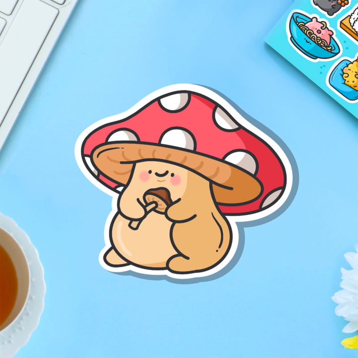 Mushroom vinyl sticker on blue table