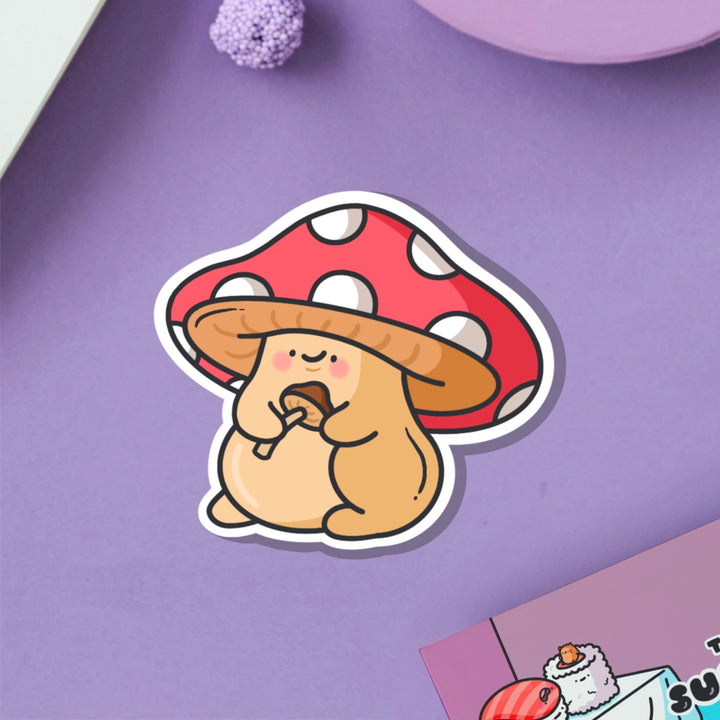 Mushroom vinyl sticker on purple table