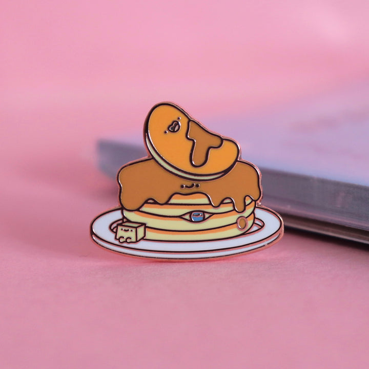 Pancakes enamel pin on pink table with notepad