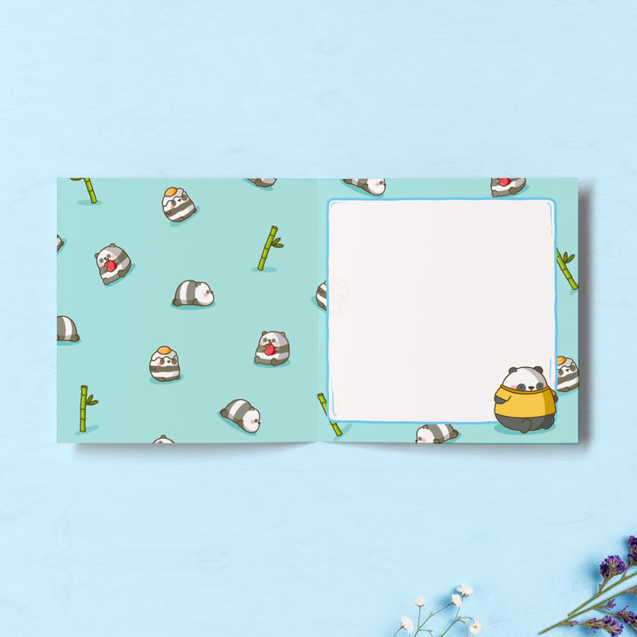 Panda print inside card on blue table