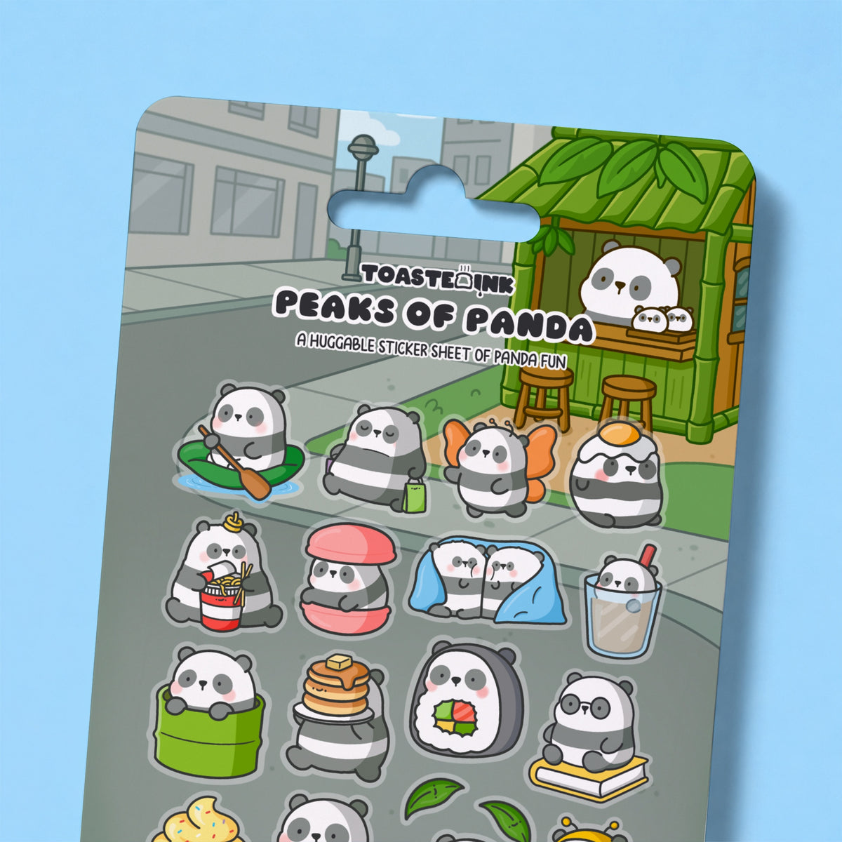 Close up of panda sticker sheet on blue desk