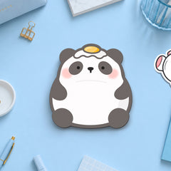 Panda with egg on his head sticky notes on blue desk