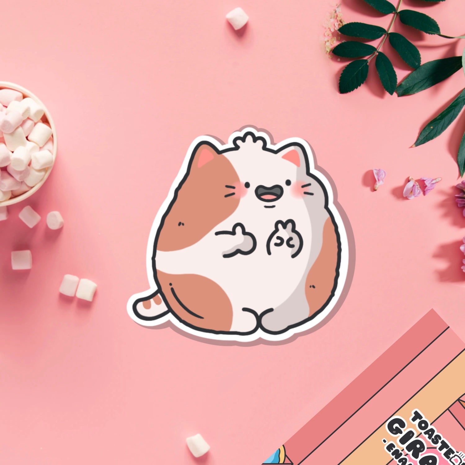 cat with peace sign vinyl sticker on pink table