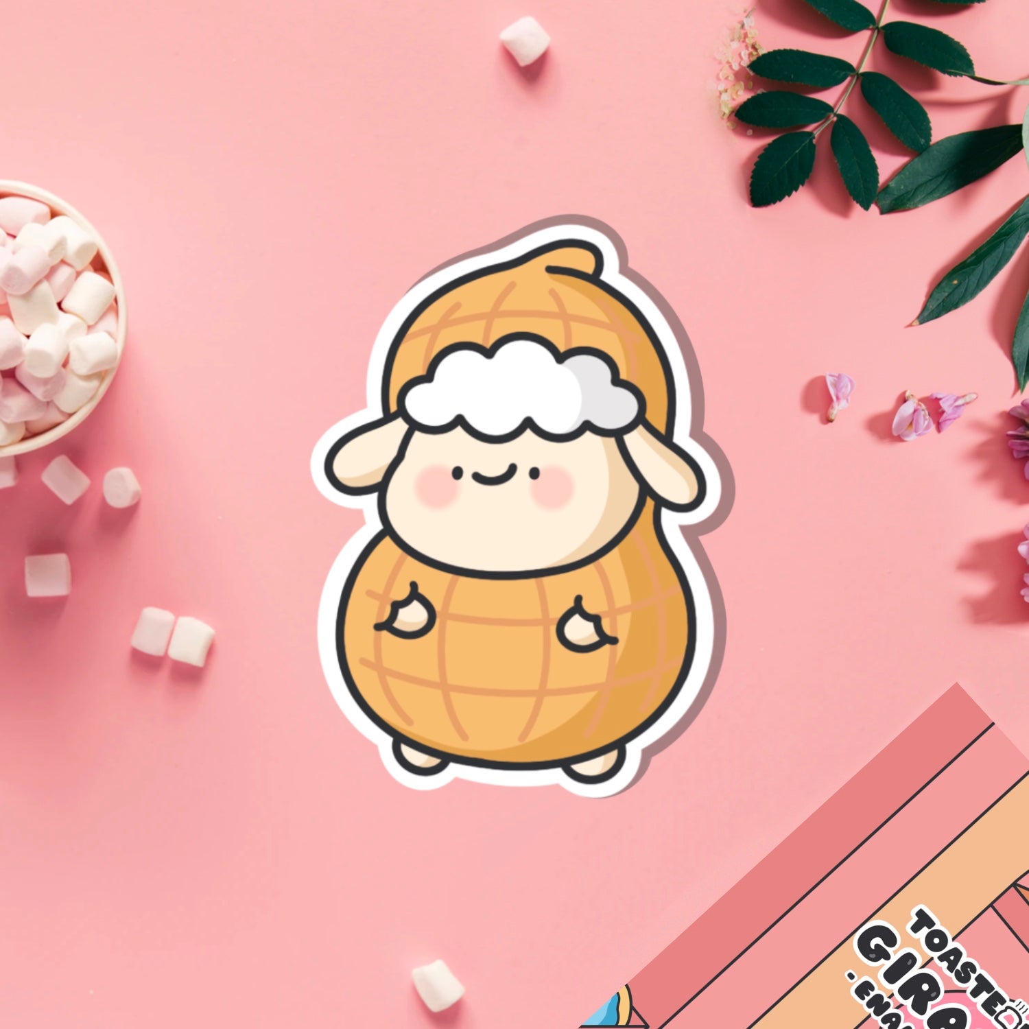 Sheep dressed as peanut vinyl sticker on pink table