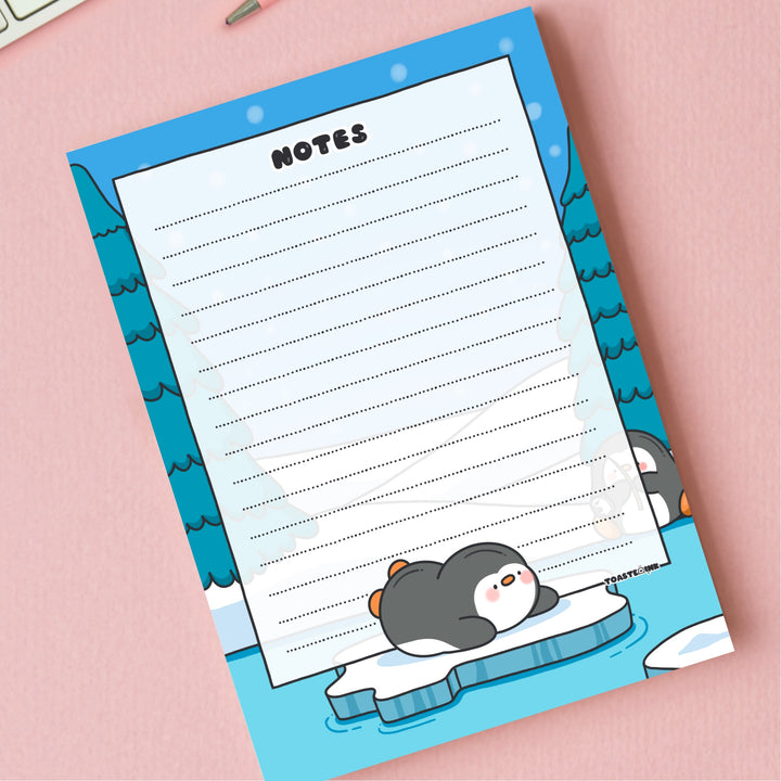 A6 Penguin Notepad on pink desk close up