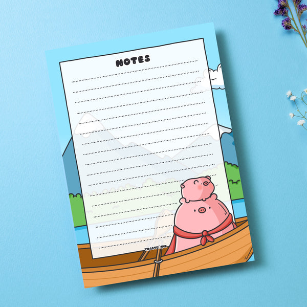 A6 Pig Notepad on blue table with flowers