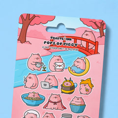 Close up of pig sticker sheet on blue desk
