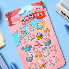 Pig sticker sheet on blue table with stationery items 