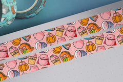 Pig washi tape on notebook and blue table