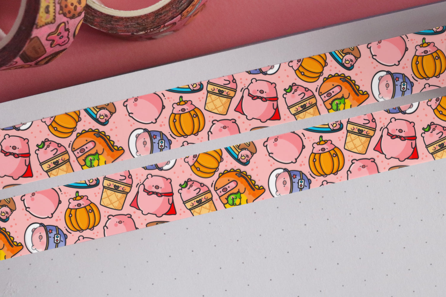 Pig washi tape on pink table and notebook