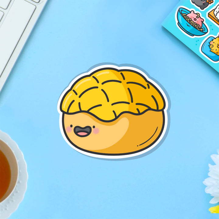 Pineapple bun vinyl sticker on blue table