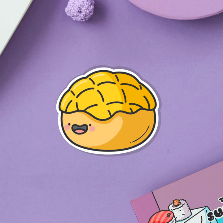 Pineapple bun vinyl sticker on purple table