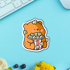Bear with popcorn vinyl sticker on green table