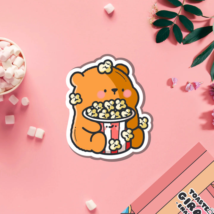 Bear with popcorn vinyl sticker on pink table