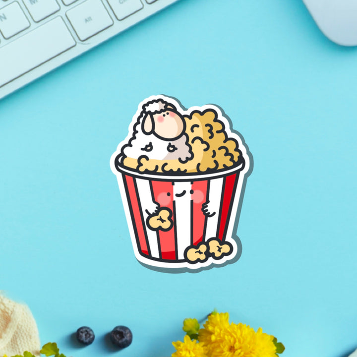 Sheep in popcorn vinyl sticker on green table