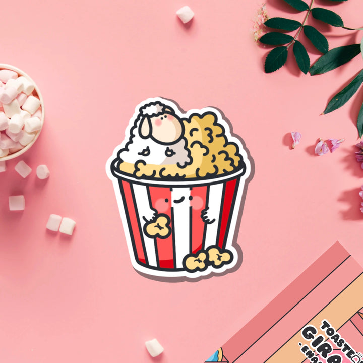 Sheep in popcorn vinyl sticker on pink table