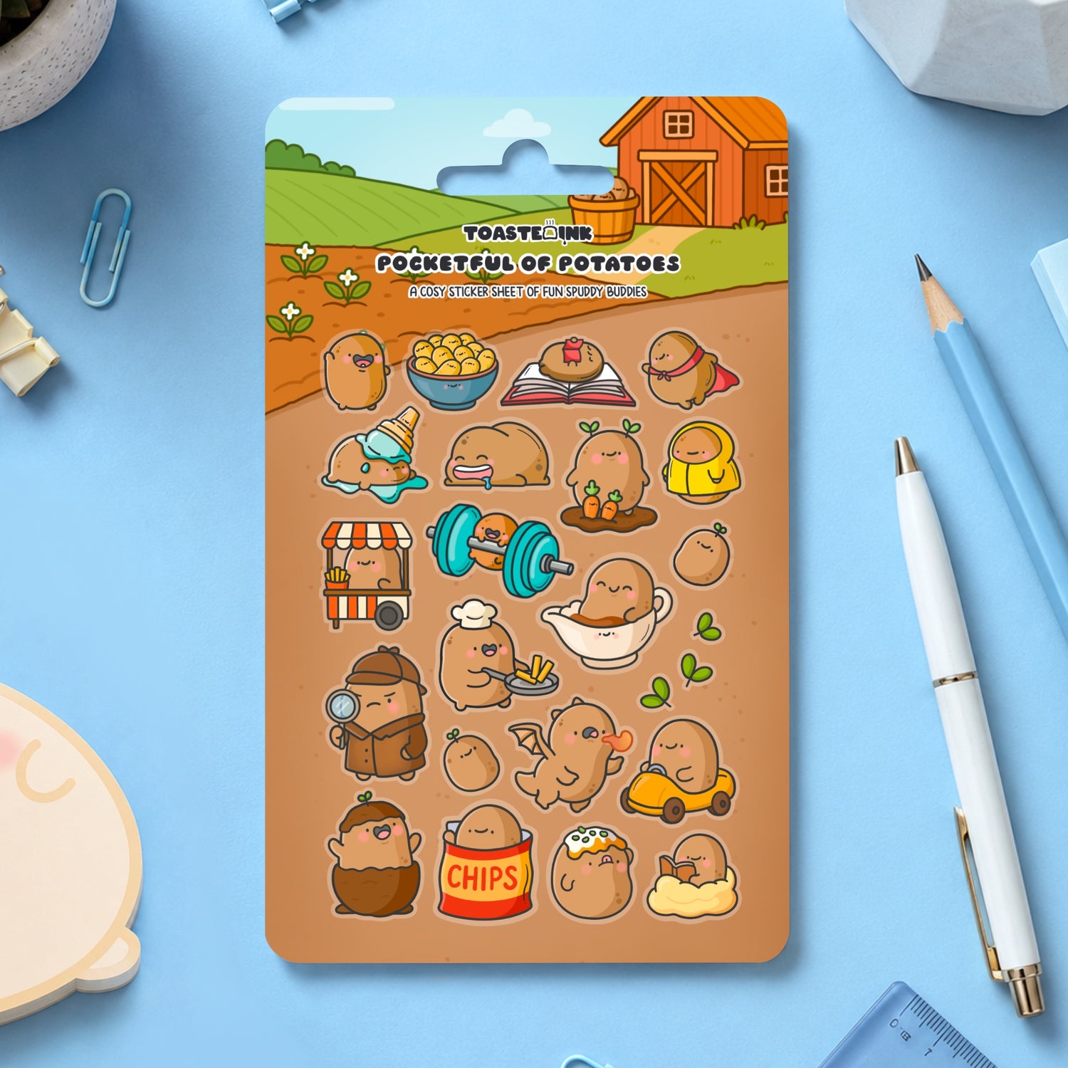 Potato sticker sheet with stationery pieces on blue table