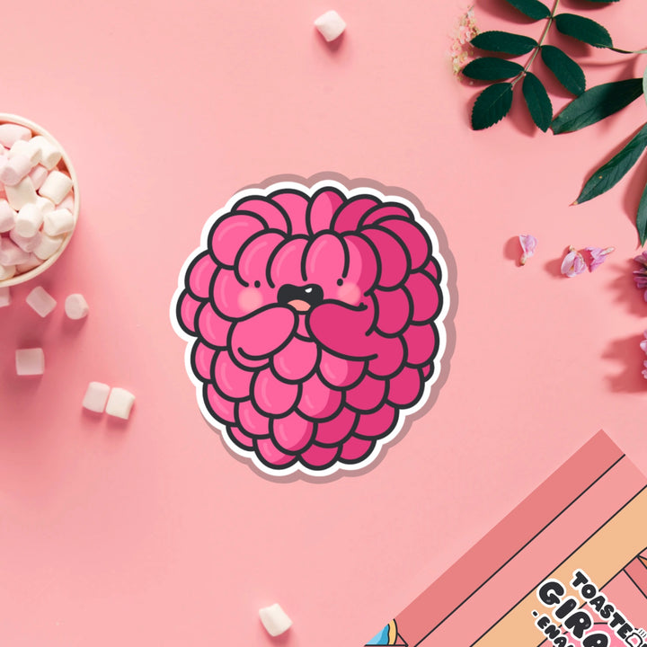 Raspberry vinyl sticker on pink table