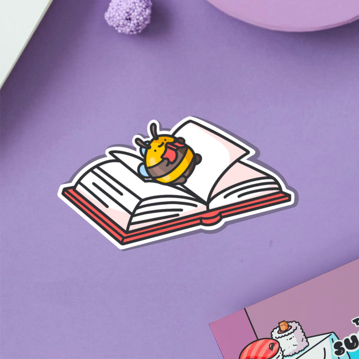 Reading bee vinyl sticker on purple table