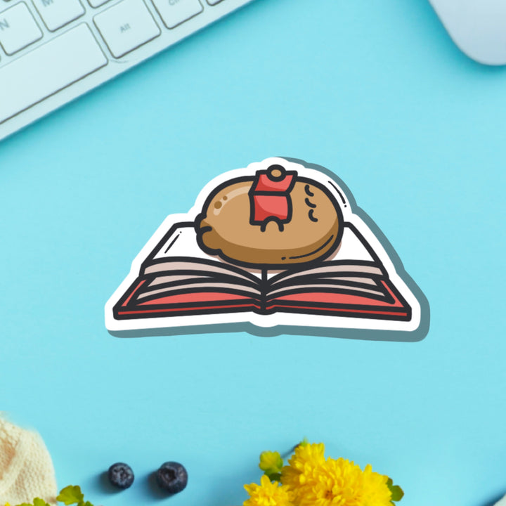 Potato reading a book vinyl sticker on blue background