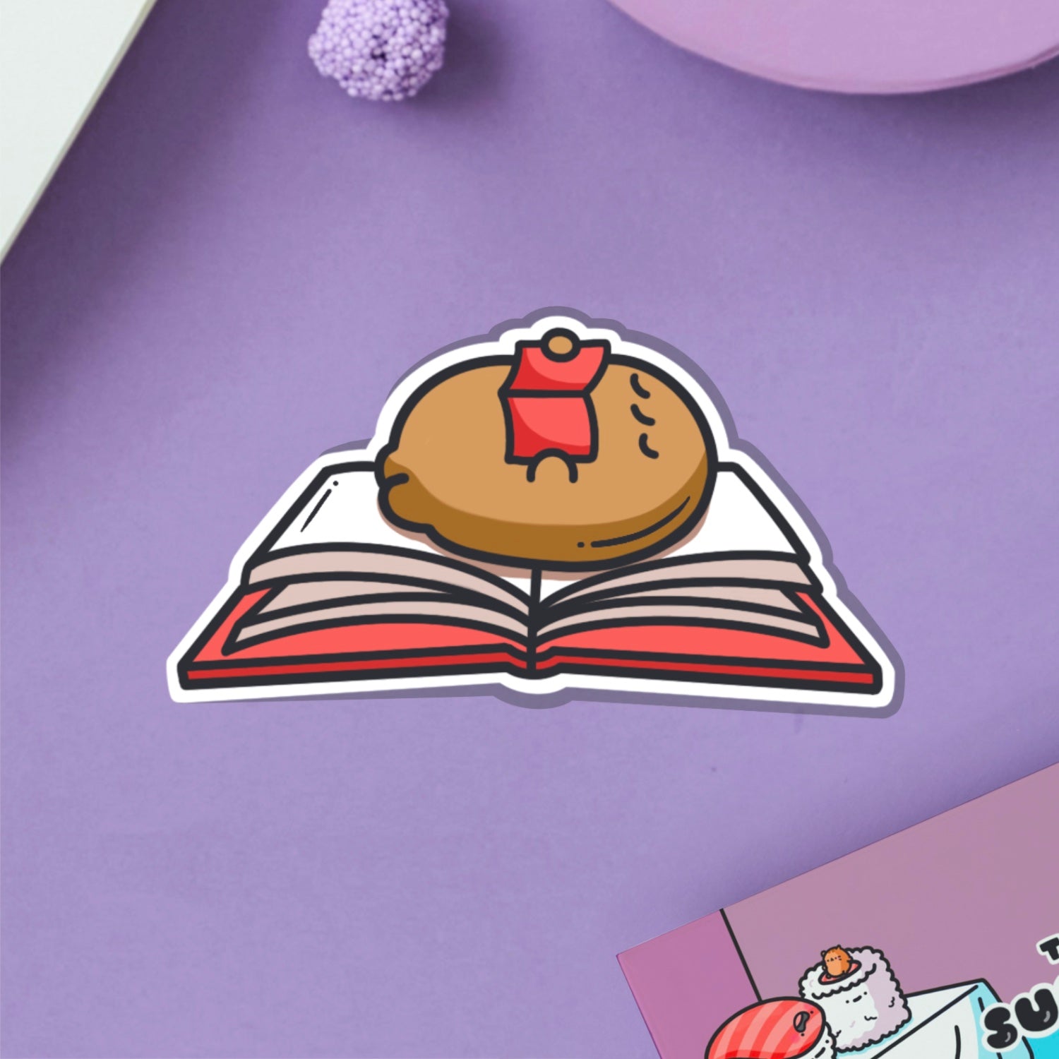 Reading potato vinyl sticker on purple table