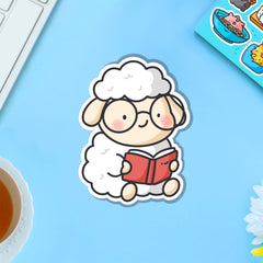 Reading sheep vinyl sticker on blue table