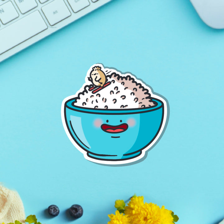 Rice Bowl with dumpling skiing vinyl sticker on blue table with keyboard