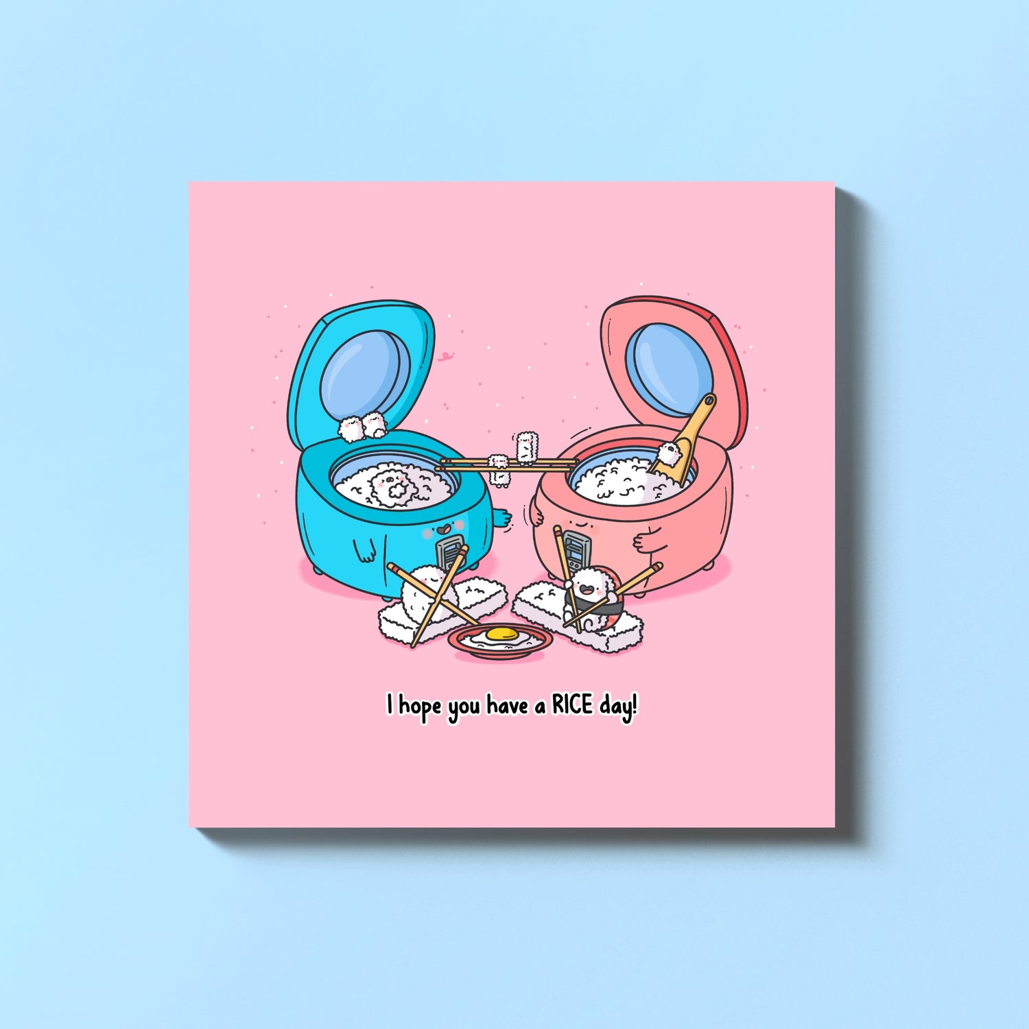 Rice cooker greeting card on blue table