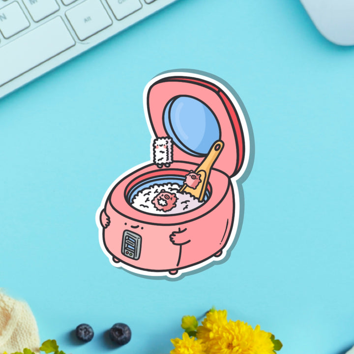 Rice cooker vinyl sticker on blue table with keyboard