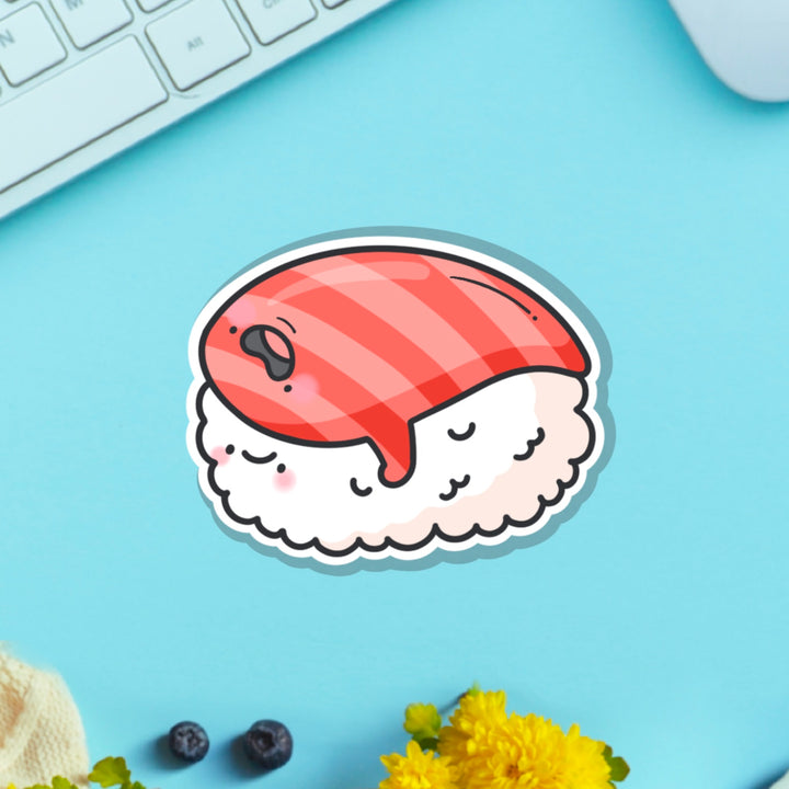 salmon sushi vinyl sticker on blue table with keyboard