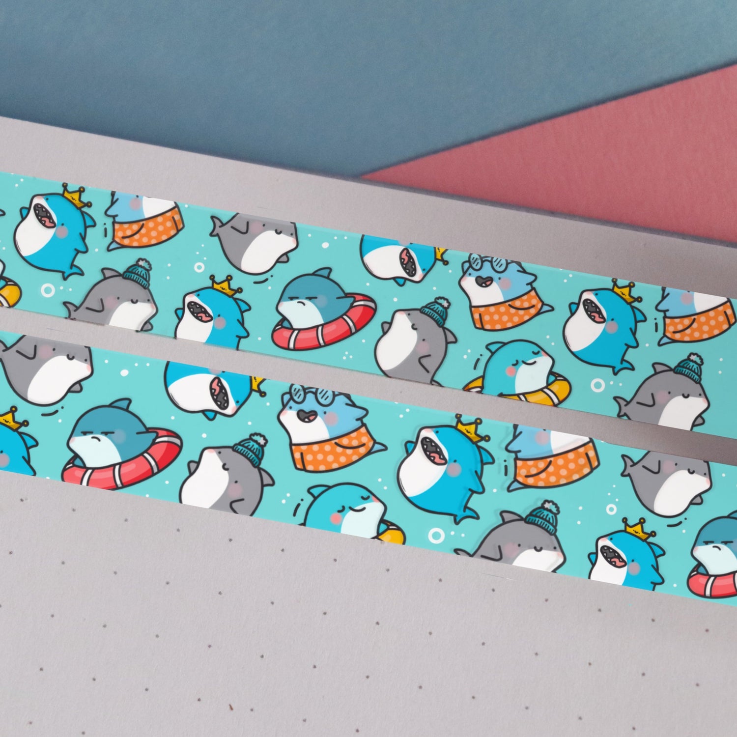 Blue shark print washi tape on blue and pink table