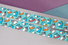 Blue shark print washi tape on purple and blue table