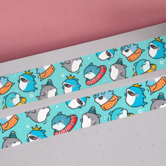 Blue shark print washi tape on pink background