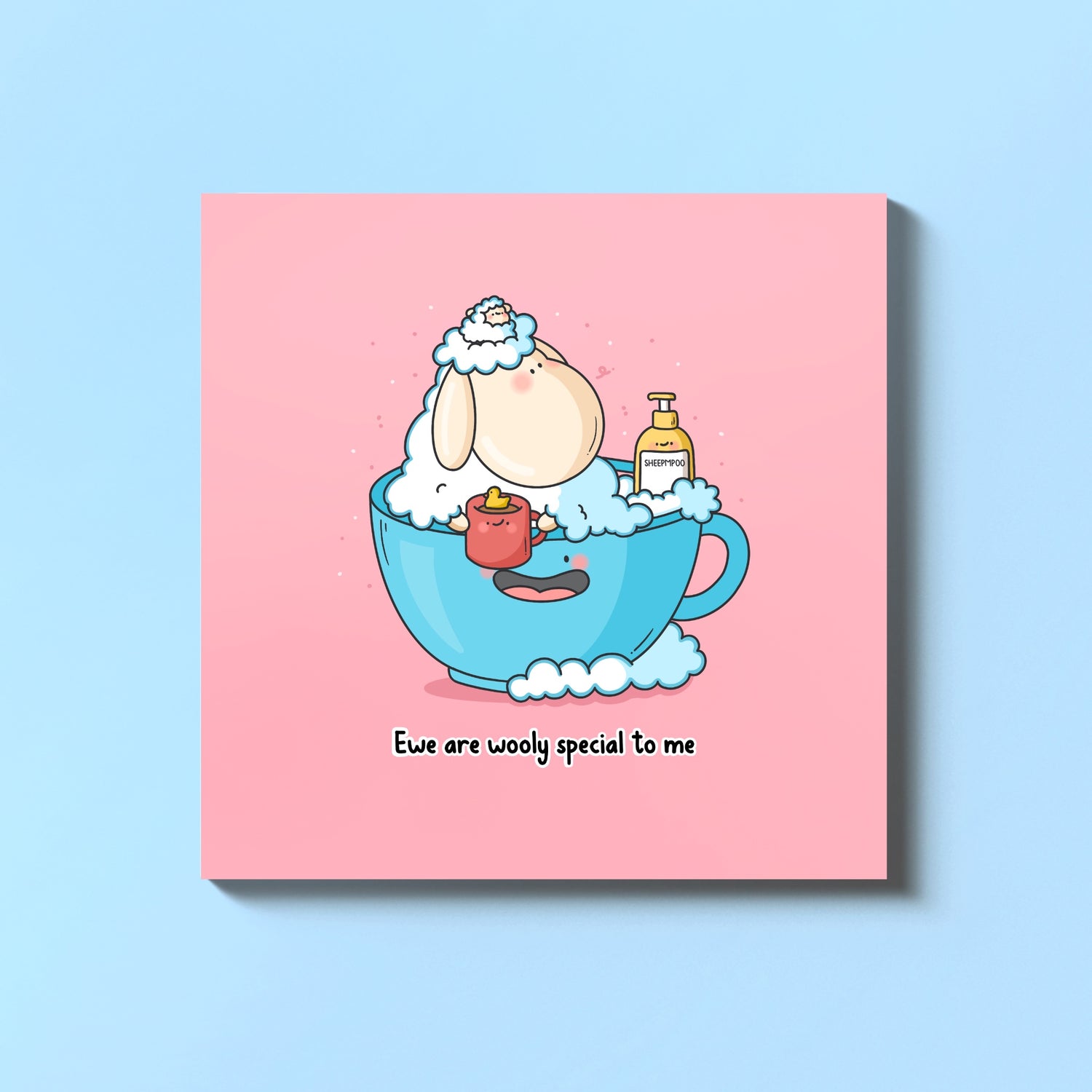 Sheep in a mug card on blue table