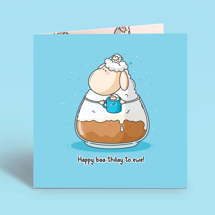 Sheep birthday card on blue table