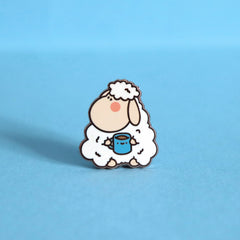 Sheep enamel pin on blue background