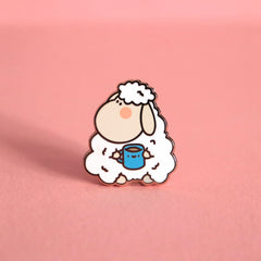 Sheep enamel pin on pink table