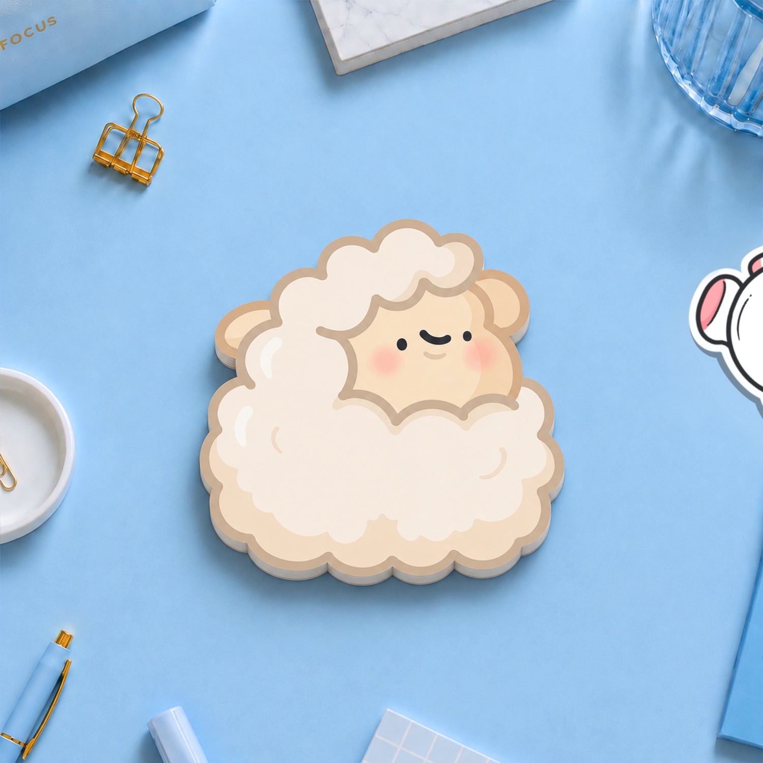 Sheep sticky notes with stationery on blue table