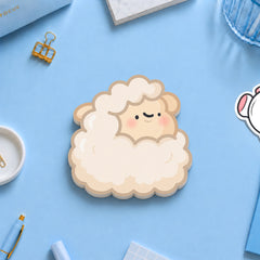 Sheep sticky notes with stationery on blue table