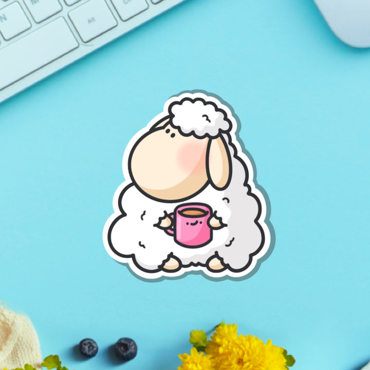 Sheep vinyl sticker on blue table with keyboard