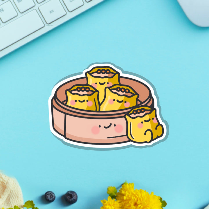 Siu Mai vinyl sticker on blue table with keyboard