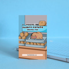 Sleeping potato enamel pin on backing card with notepad