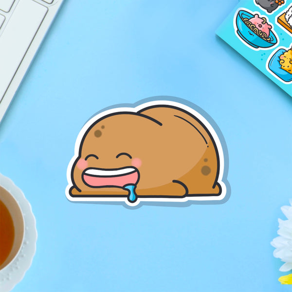 sleeping potato vinyl sticker on blue table