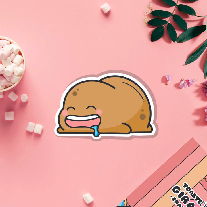 sleeping potato vinyl sticker on pink table