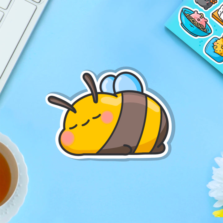 Sleepy Bee vinyl sticker on blue table