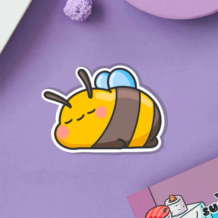 Sleepy Bee vinyl sticker on purple table