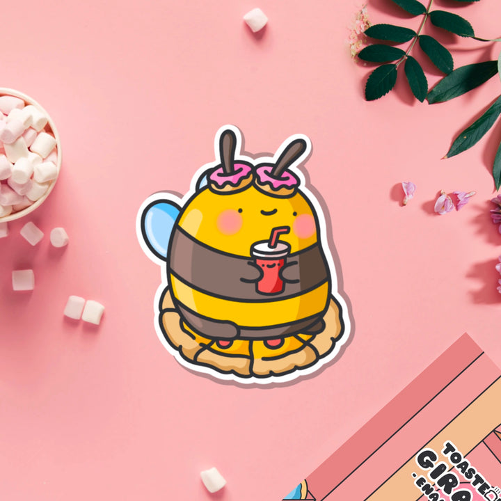 Snacking bee vinyl sticker on pink table