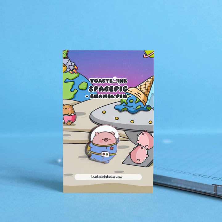 Space Pig enamel pin on space backing card